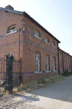 Old Red Brick Building With Broken Windows And Iron Gate, Bulcote, Stock Photos