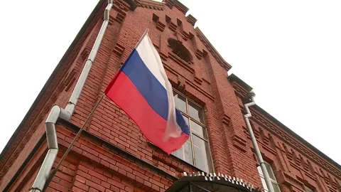 The old red brick building of the Russian flag Stock Footage 101674689