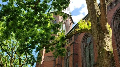 Old red brick church on a square in Oldenburg, Germany 스톡 동영상 166055877