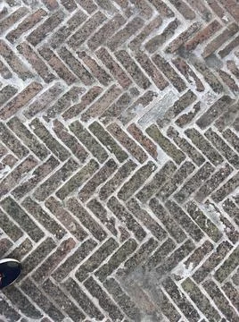 Old red brick floor in the shape of a fish ear Stock Photos