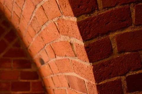 Old red brick wall with an arc background Stock Photos