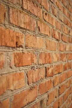 Old red brick wall background. Perspective view Photos