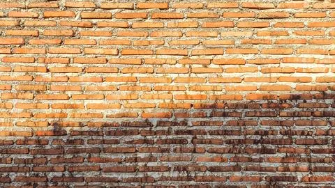 Old red brick wall background with weathered texture and rustic charm. Perf.. Stock Photos