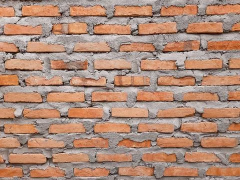 Old Red Brick Wall with Cement Mortar Texture for Architecture Background Foto stock