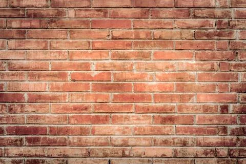 Old red brick wall with cracks and scratches. Horizontal wide brickwall. Stock Photos