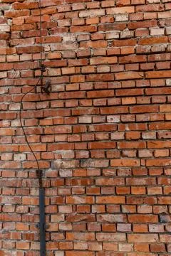Old red brick wall damaged lightning rod collapsing brick wall Stock Photos