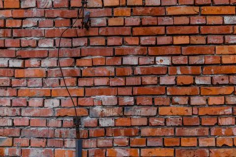 Old red brick wall damaged lightning rod collapsing brick wall Stock Photos