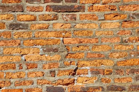 Old red brick wall for design. Texture. Background. Stock Photos