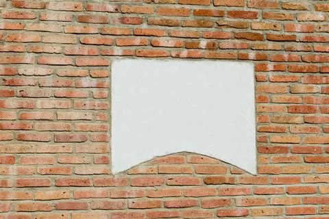 An old red brick wall with a gray stone for the inscription for mockup Stock Photos