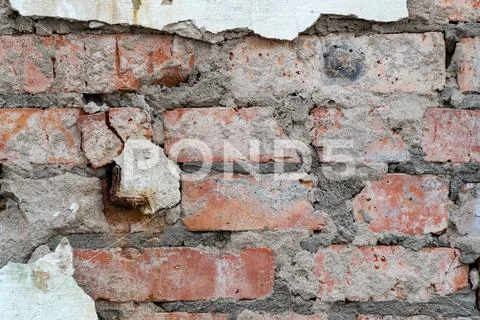 Old red brick wall with plaster Stock Photos