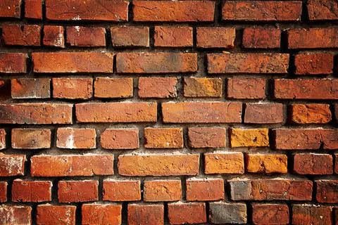 Old red brick wall rough texture background Stock-Fotos