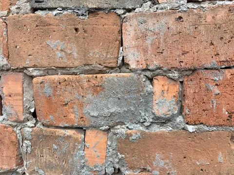 Old Red Brick Wall with Rough Cement Texture Fotos de archivo