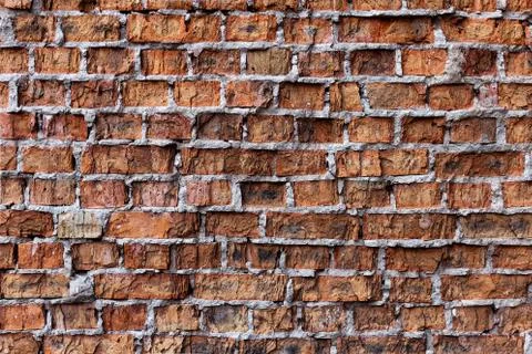 Old red brick wall, rustic, shattered texture, design background. Stock Photos