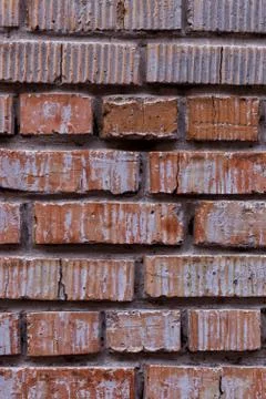 Old red brick wall, rustic texture, design vertical background. Stock Photos