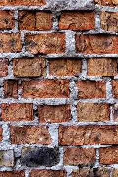 Old red brick wall, rustic, shattered texture, design vertical background. Stock Photos
