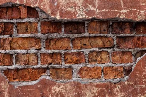 Old red brick wall, rustic, shattered texture, design background. Stock Photos