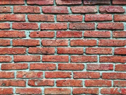 Old red brick wall texture background in close-up Foto stock