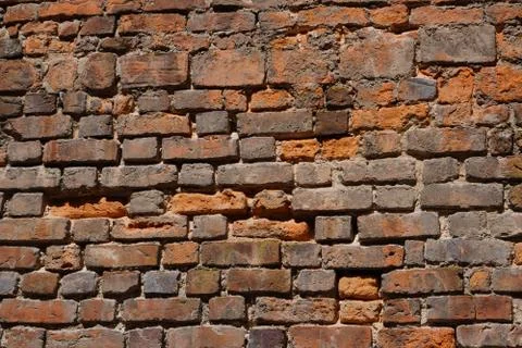 Old red brick wall texture background. Civil and industrial construction. Stock Photos