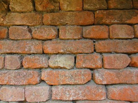 Old red brick wall texture background with moss and dirt Stock Photos