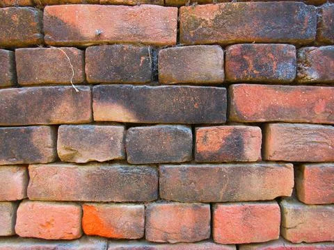 Old red brick wall texture background with moss and dirt Stock Photos