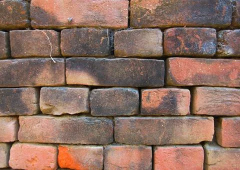 Old red brick wall texture background with moss and dirt Stock Photos