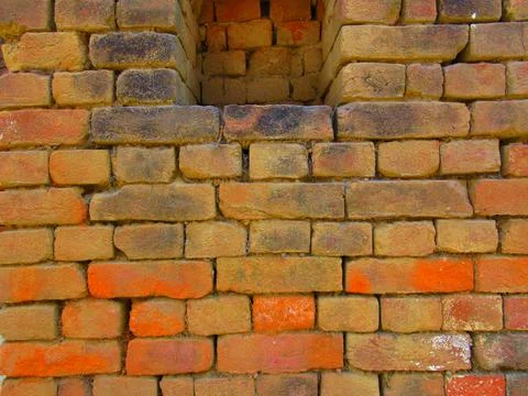 Old red brick wall texture background with moss and dirt Fotos de archivo