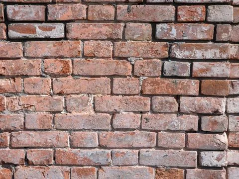 Old red brick wall texture weathered and peeling surface grunge background .. 库存照片