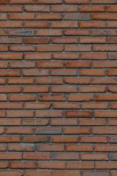Old Red Brick Wall Texture with Orange, Brown, and Dark Gray Tones Stock Photos