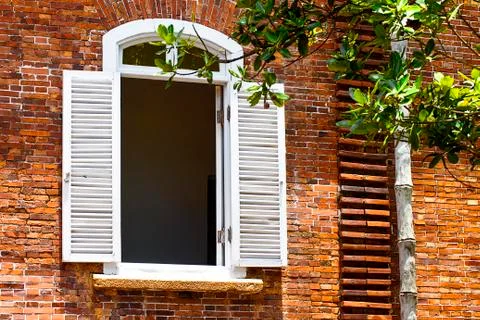 Old red brick wall with window Stock Photos