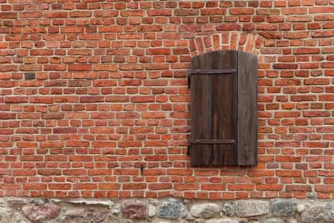 Old red brick wall with window Stock Photos