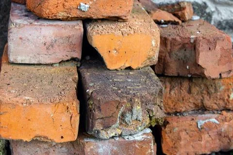 Old red bricks lying on top of each other. Concept of building Foto stock