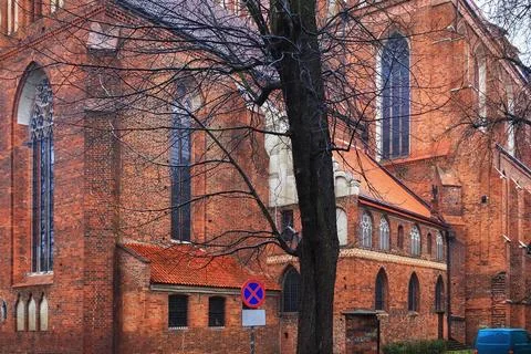 Old red bricks walls of the gothic catholic church of St. John the Baptist .. Stock Photos