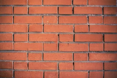 An old red-brown brick wall. Texture Background. Stock Photos