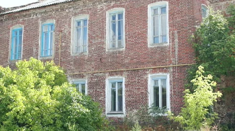 Old red building with large Windows Video stock 57324994