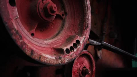 Old red combine harvester pulleys for moving Stock-Footage 335207010