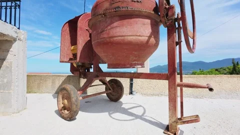 Old Red Concrete Mixer Working at Building Site Stock Footage 309704585