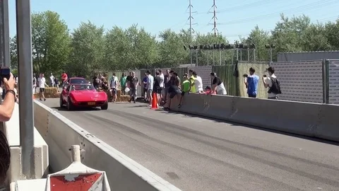 Old Red Corvette on the speedway Video stock 81228572