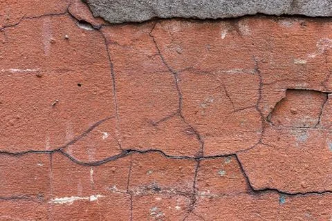 Old red cracked wall, rustic texture, design background. Stock Photos
