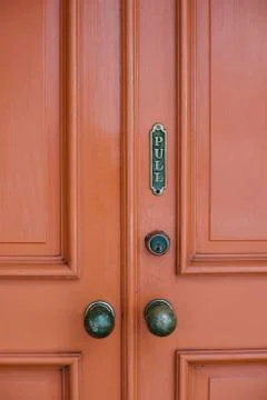 Old Red Door with Pull Sign and Old Door Knobs Fotos de archivo