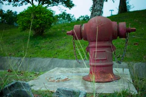 Old Red fire hydrant on a sidewalk Stock Photos