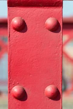 Old red metal background with rivets Stock Photos