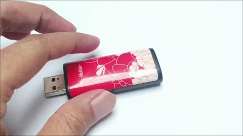 Old red mobile broadband USB modem with floral design Video stock 335804719