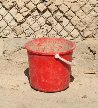 Old red plastic bucket Stock Photos