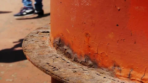 Old red rusty pipe of large ship above calm blue wavy water surface close vie Stock-Footage 114625595