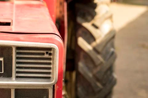 Old red seed tractor from the front Stock Photos