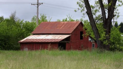 A old red stained barn. Stock Photos