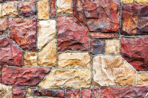 Old red stone wall texture background for design Stock Photos
