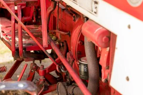 Old red tractor engine of a Same tractor 스톡 사진