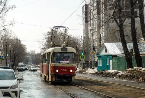 An old red tram passes through the streets of Ulyanovsk 스톡 사진