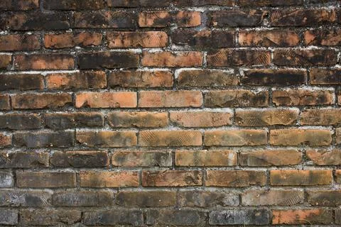 Old red white black brick wall. Rough surface texture. dirty brick wall. Foto stock